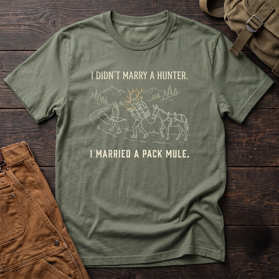 Military Green funny hunting t-shirt with I Didn't Marry A Hunter, I Married A Pack Mule text and a line-art bowhunter walking ahead of a partner who packs out an elk rack, next to a pack mule