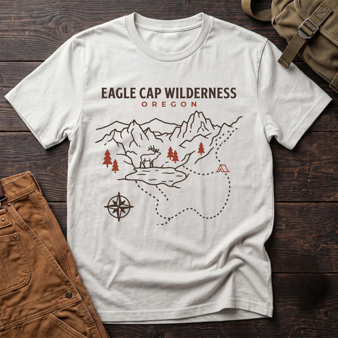 White Eagle Cap Wilderness Oregon t-shirt with a line-art trail map of peaks, lakes, red pines, a compass and an elk