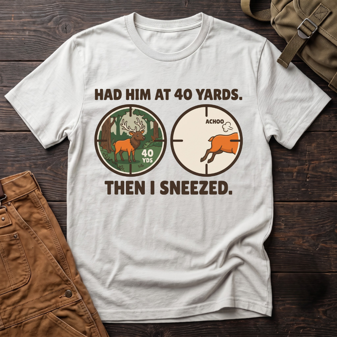 White funny elk hunting t-shirt with Had Him At 40 Yards. Then I Sneezed. and two scope views, an elk at 40 yards and the elk running after Achoo