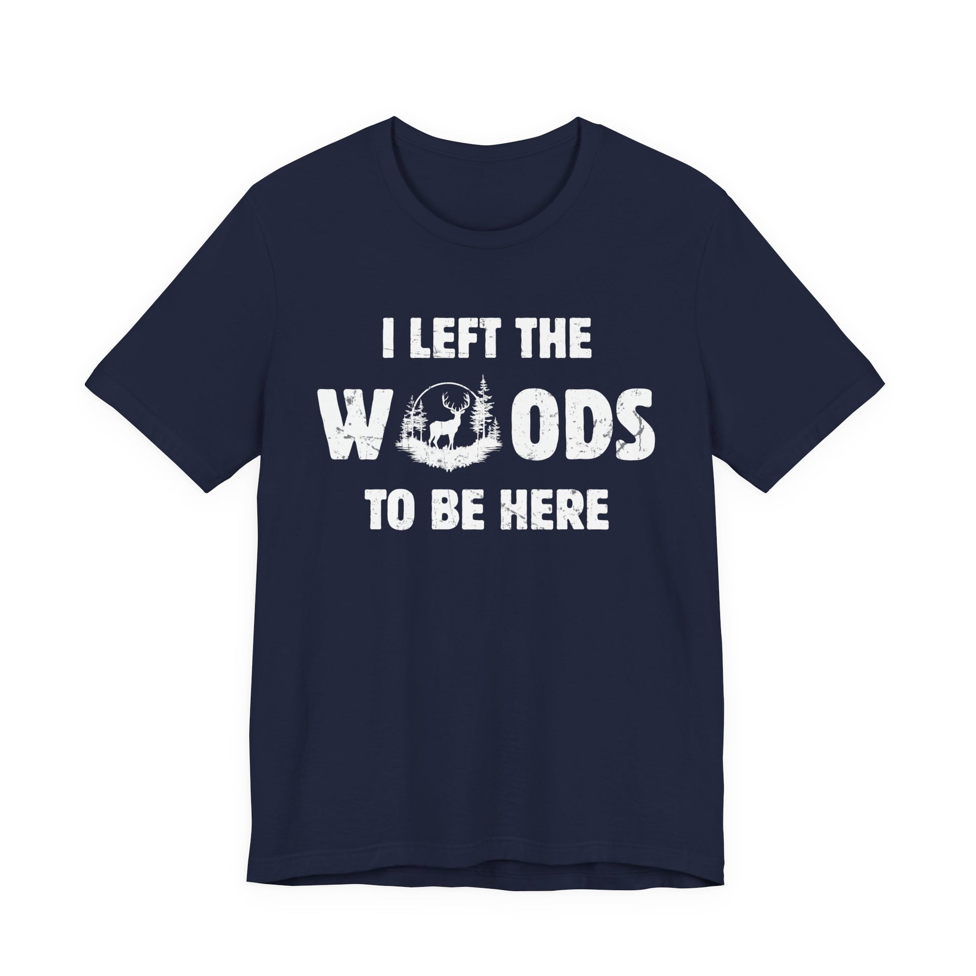 Funny hunting t-shirt in navy on a white background with the I Left the Woods to Be Here slogan and whitetail deer woodland circle graphic.