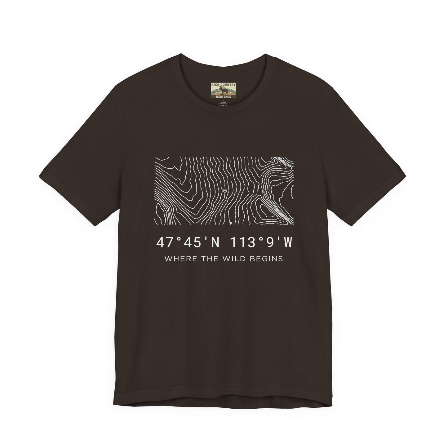 High Country Heritage Montana hunting coordinates t-shirt in Brown, displaying the minimalist topo map design from the Bob Marshall Wilderness and the tagline Where the Wild Begins.