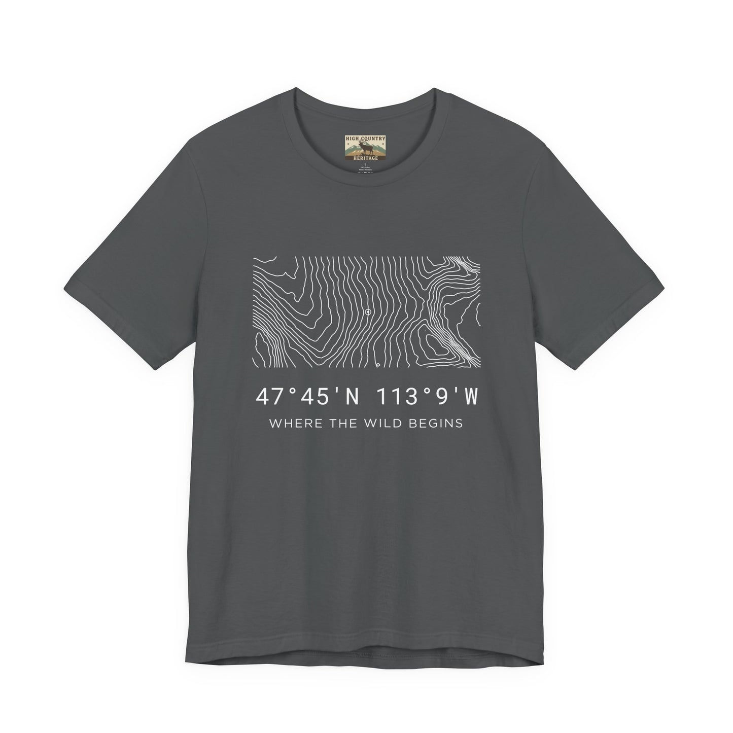 High Country Heritage Montana topographic map t-shirt in Asphalt, showing the white minimalist contour map and Bob Marshall Wilderness GPS coordinates with the tagline Where the Wild Begins on a clean white background.