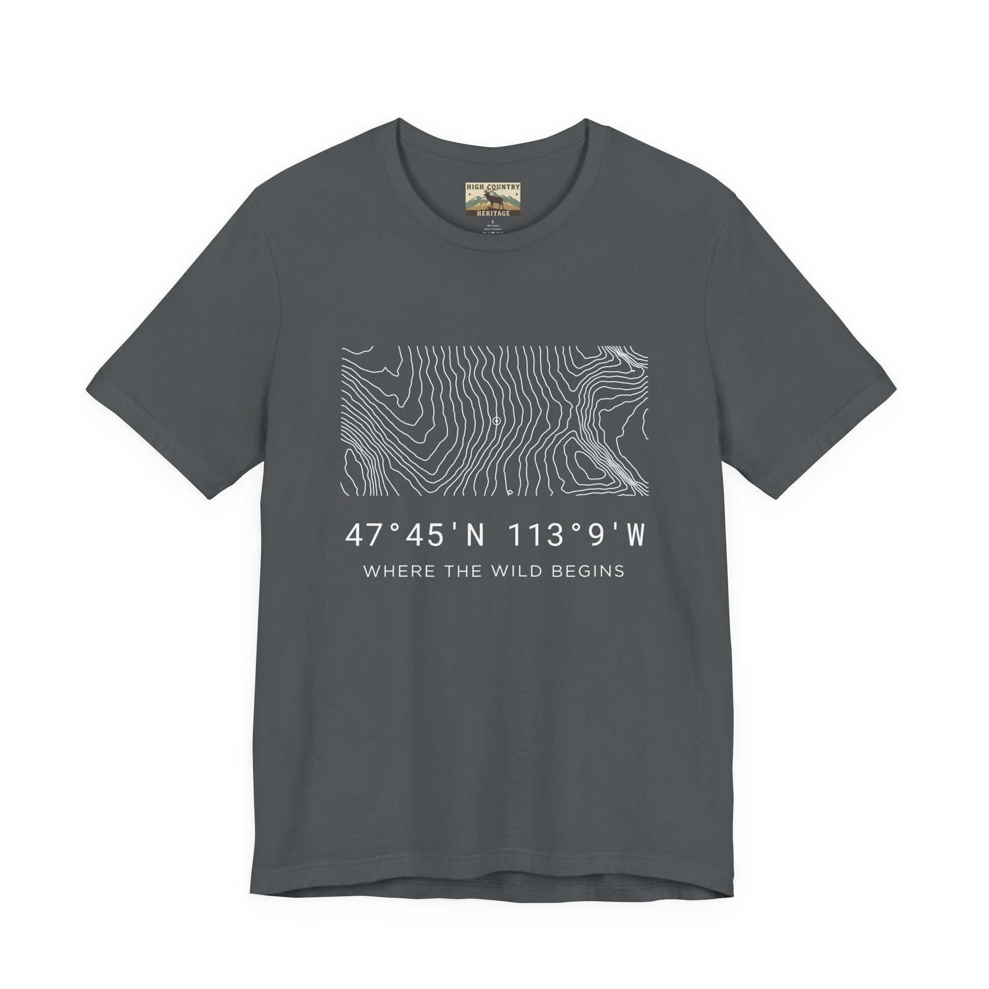 High Country Heritage Montana topographic map t-shirt in Asphalt, showing the white minimalist contour map and Bob Marshall Wilderness GPS coordinates with the tagline Where the Wild Begins on a clean white background.