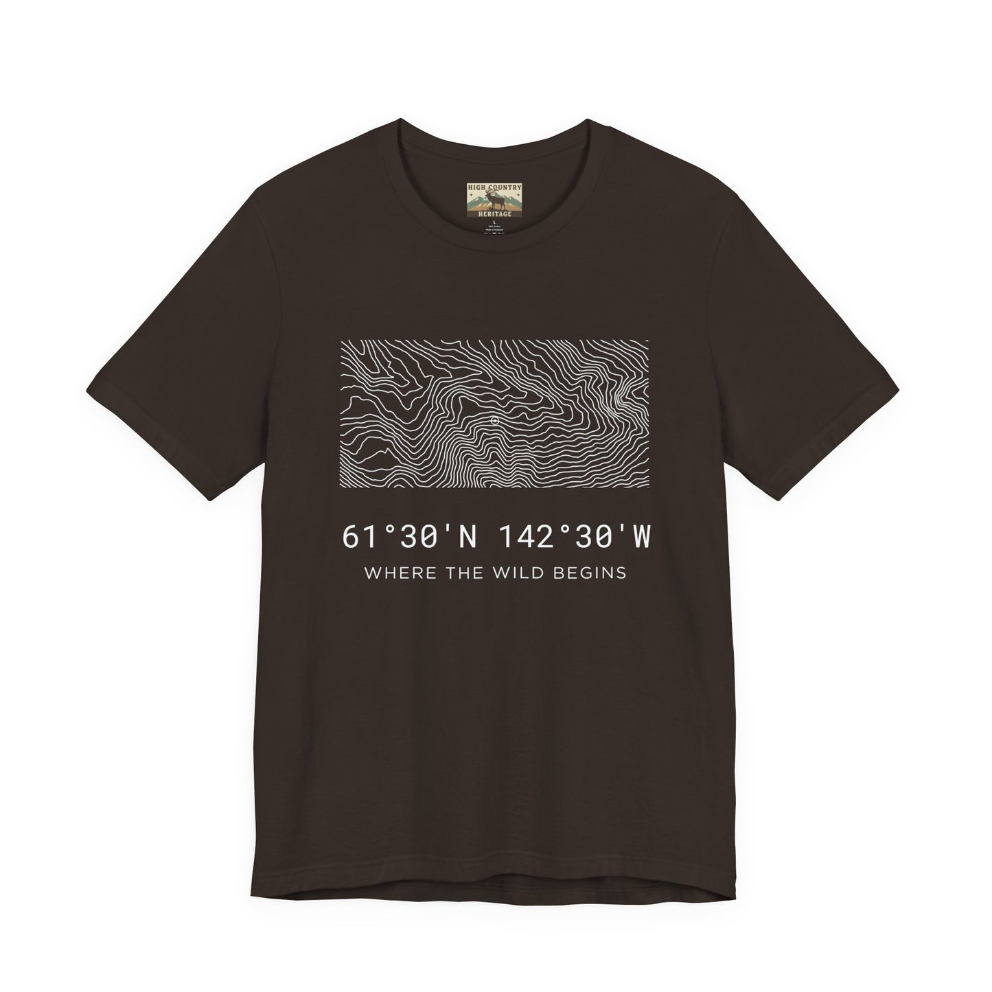 High Country Heritage Wrangell-St. Elias topo t-shirt in Brown, displaying the minimalist Alaska contour map design and the tagline Where the Wild Begins on a flat product mockup.