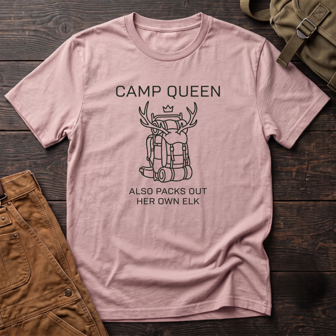 Pink funny hunting t-shirt with Camp Queen Also Packs Out Her Own Elk text and a line-art hunting backpack loaded with elk antlers under a small crown