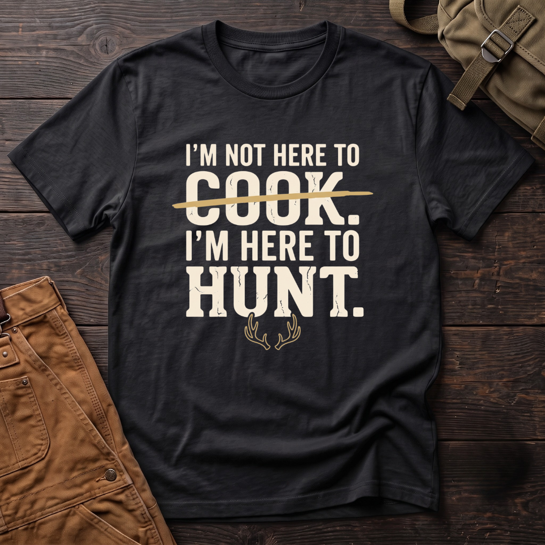 Black funny hunting t-shirt with I'm Not Here To Cook, I'm Here To Hunt text, the word Cook crossed out, and a pair of antlers