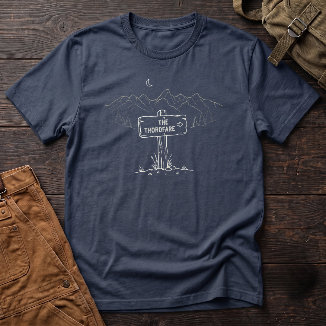 Navy Wyoming backcountry t-shirt with The Thorofare trail sign under a line-art mountain range, pine trees and a crescent moon