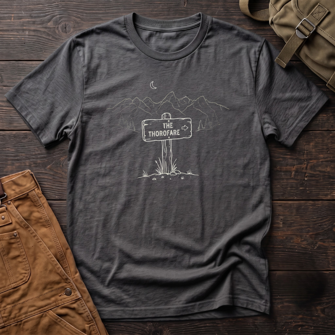 Asphalt Wyoming backcountry t-shirt with The Thorofare trail sign under a line-art mountain range, pine trees and a crescent moon