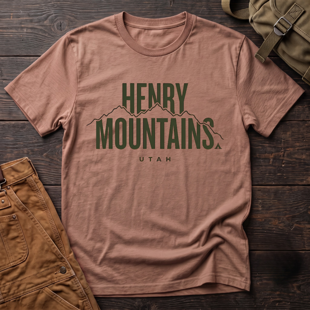 Heather Clay Utah t-shirt with bold Henry Mountains Utah lettering, a mountain ridge line and a small tent