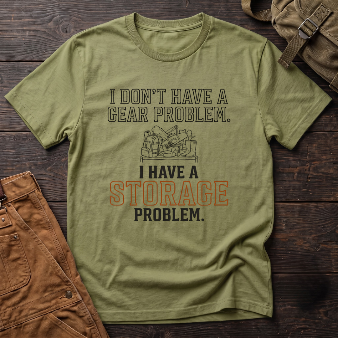 Heather Green funny hunting t-shirt with I Don't Have A Gear Problem, I Have A Storage Problem text and a pile of hunting gear on a shelf