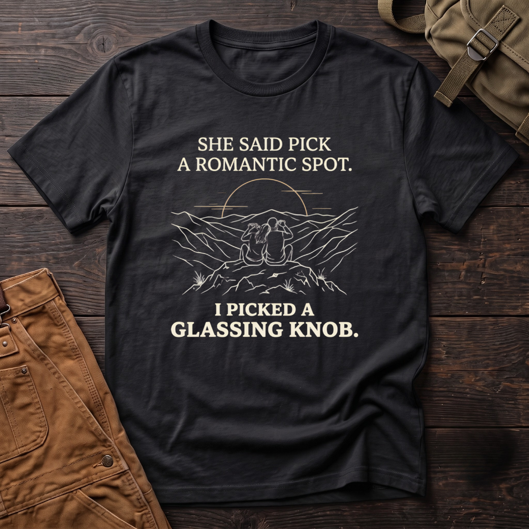Black funny hunting t-shirt with She Said Pick A Romantic Spot, I Picked A Glassing Knob text and a line-art couple glassing from a ridge at sunset