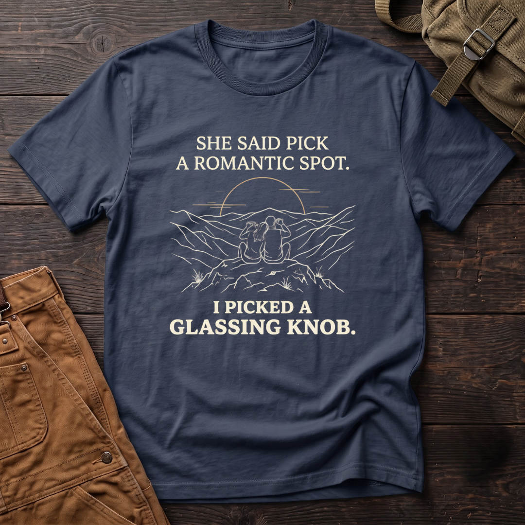 Navy funny hunting t-shirt with She Said Pick A Romantic Spot, I Picked A Glassing Knob text and a line-art couple glassing from a ridge at sunset