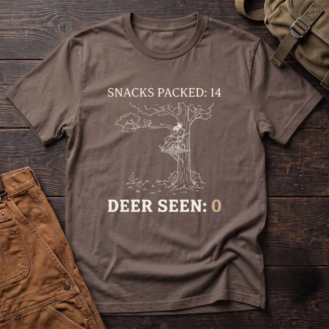 Brown funny deer hunting t-shirt with Snacks Packed: 14, Deer Seen: 0 text and a line-art hunter in a tree stand