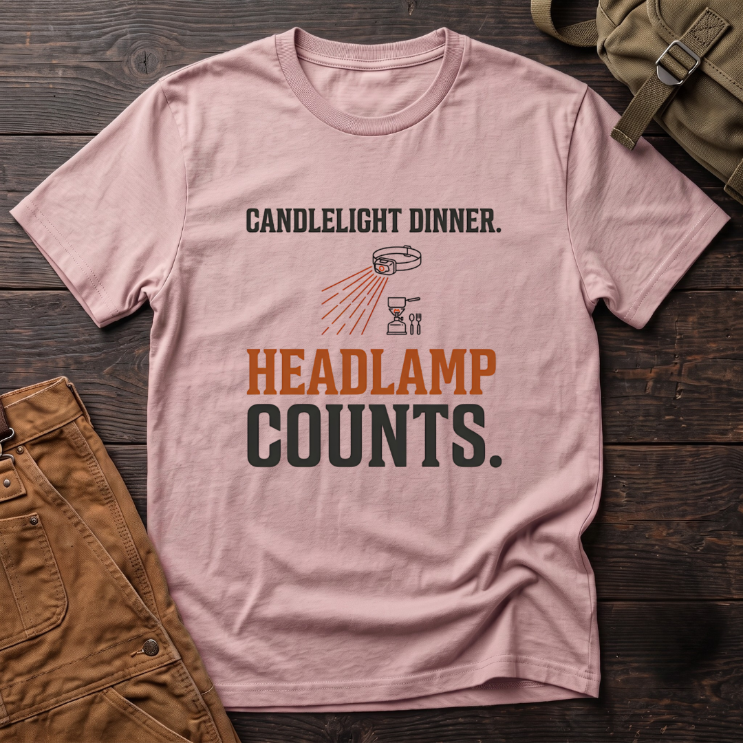 Pink funny hunting t-shirt with Candlelight Dinner. Headlamp Counts. text and a headlamp shining on a camp stove