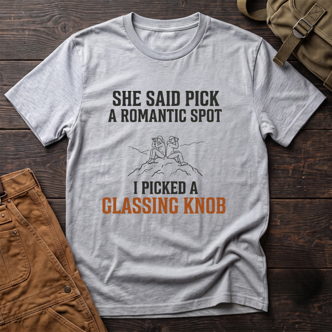 Athletic Heather funny hunting t-shirt with She Said Pick A Romantic Spot, I Picked A Glassing Knob text and a line-art couple glassing from a rocky knob