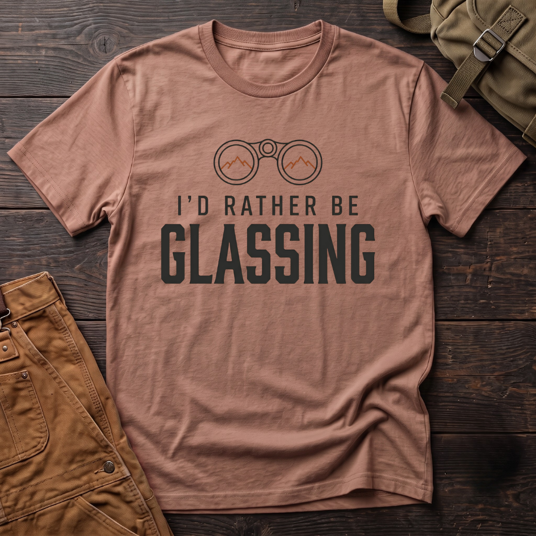Heather Clay hunting t-shirt with I'd Rather Be Glassing text and binoculars with mountains in the lenses