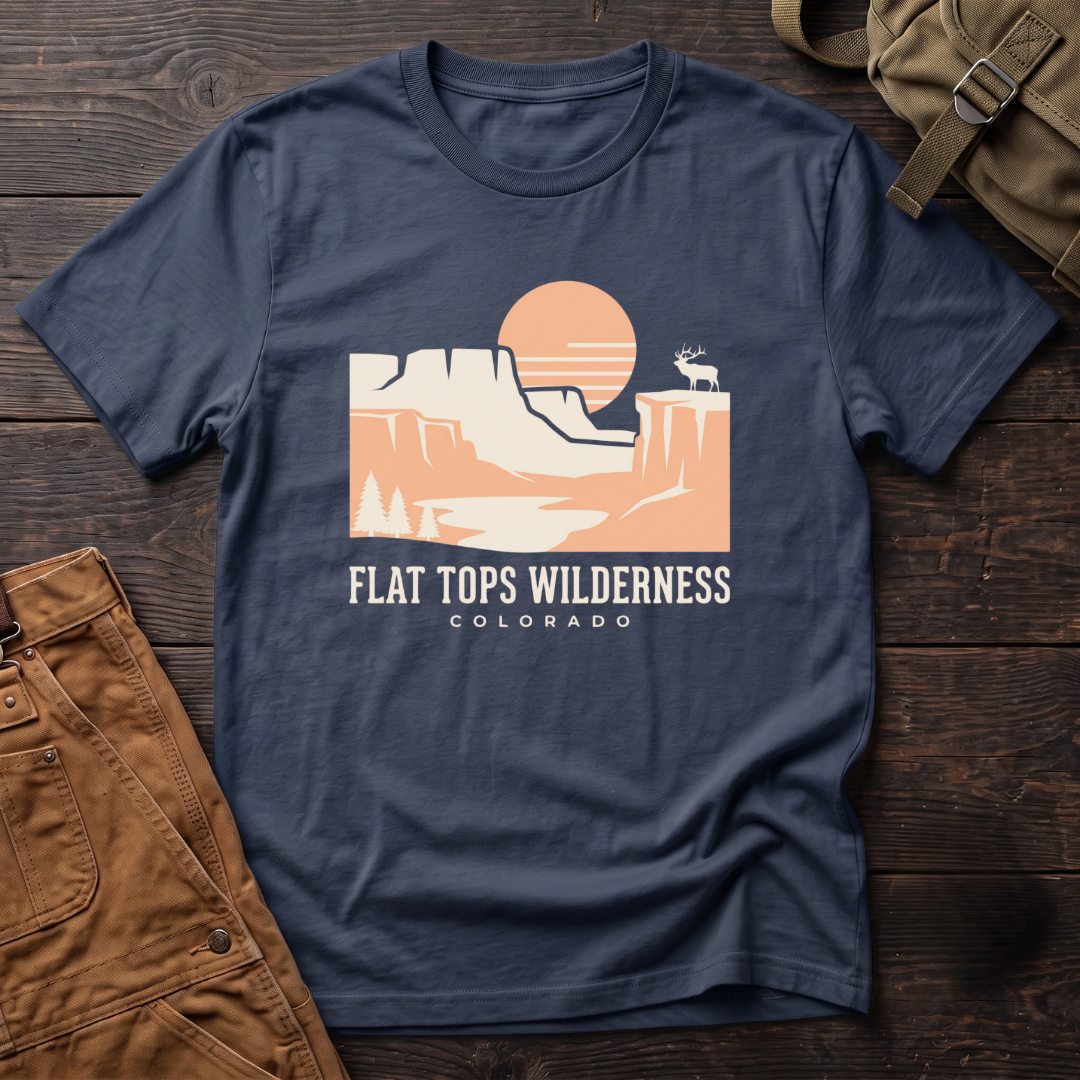 Navy Flat Tops Wilderness Colorado t-shirt with a peach sunset over flat-topped cliffs and an elk on the rim