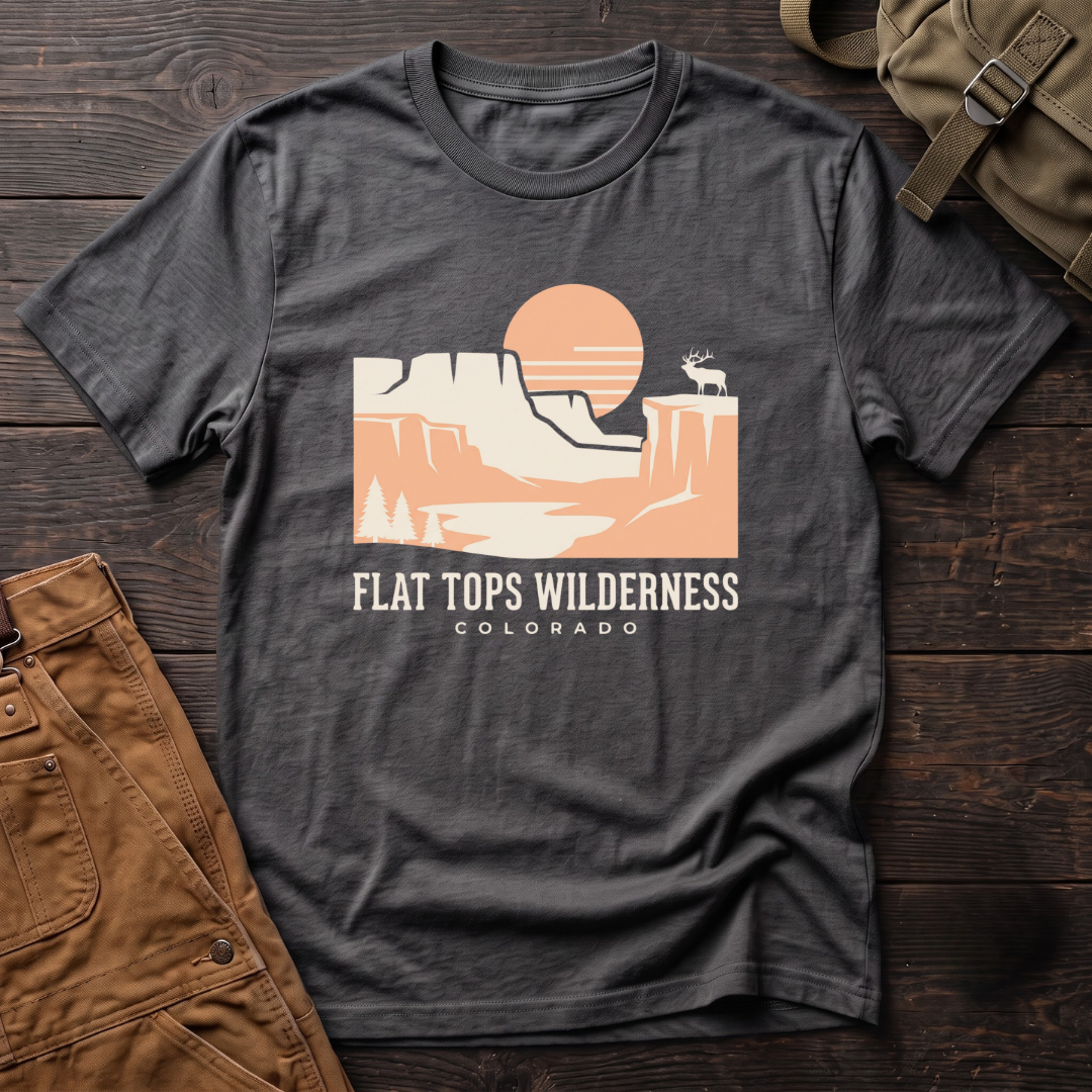 Asphalt Flat Tops Wilderness Colorado t-shirt with a peach sunset over flat-topped cliffs and an elk on the rim