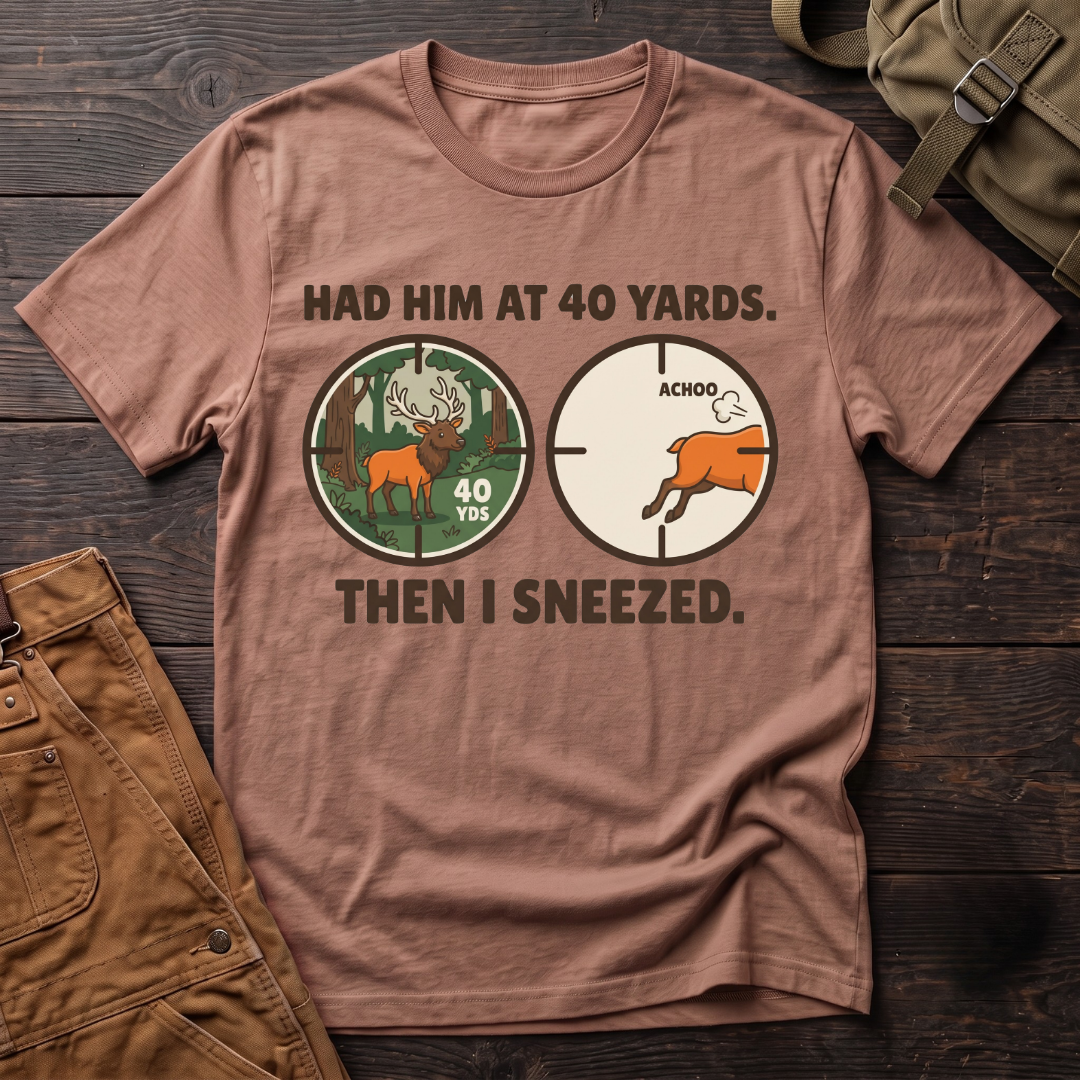 Heather Clay funny elk hunting t-shirt with Had Him At 40 Yards. Then I Sneezed. and two scope views, an elk at 40 yards and the elk running after Achoo