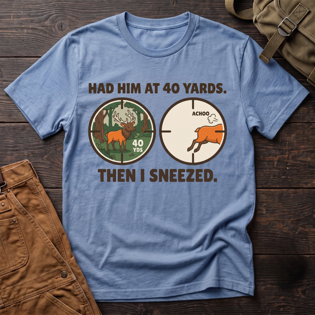 Heather Columbia Blue funny elk hunting t-shirt with Had Him At 40 Yards. Then I Sneezed. and two scope views, an elk at 40 yards and the elk running after Achoo