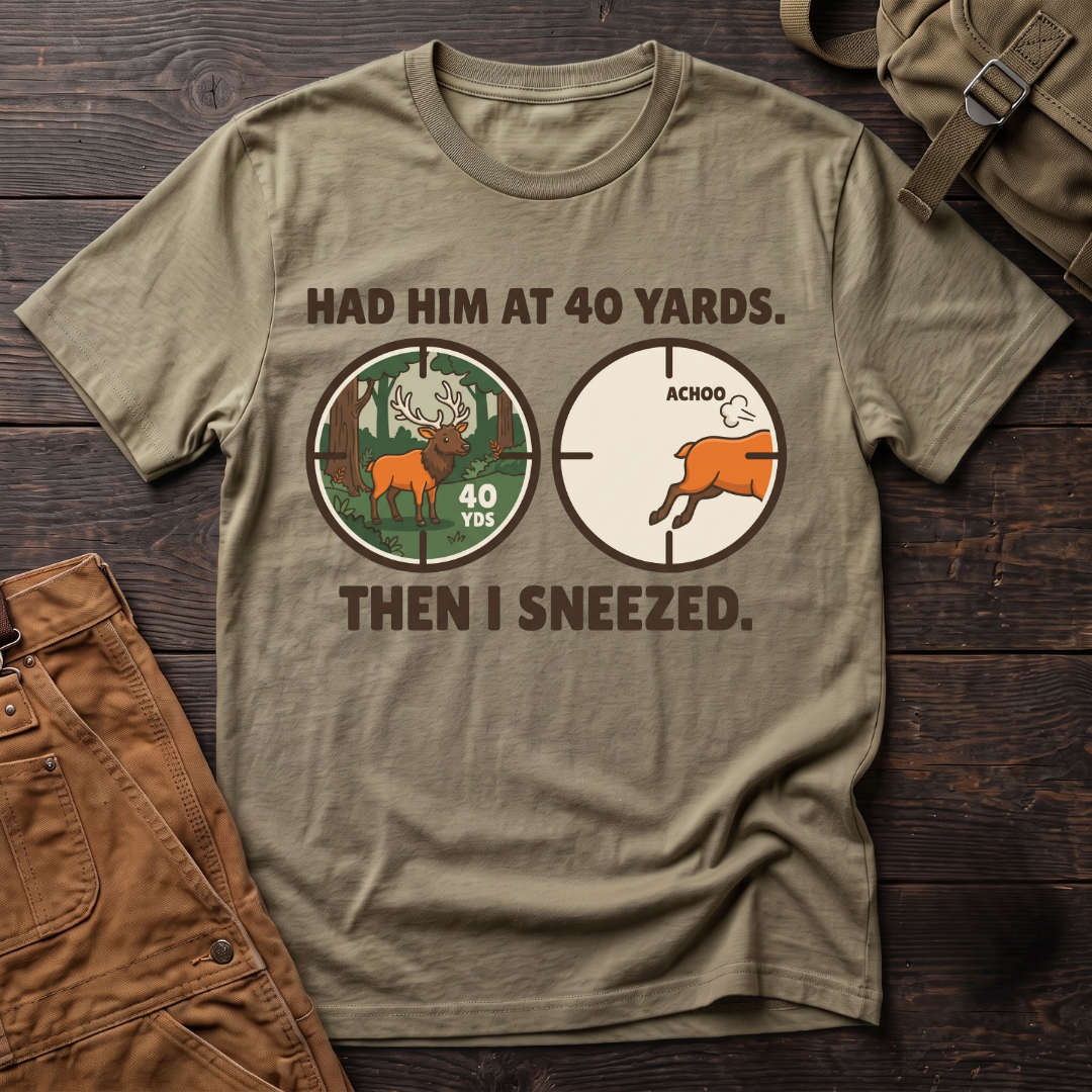 Heather Olive funny elk hunting t-shirt with Had Him At 40 Yards. Then I Sneezed. and two scope views, an elk at 40 yards and the elk running after Achoo