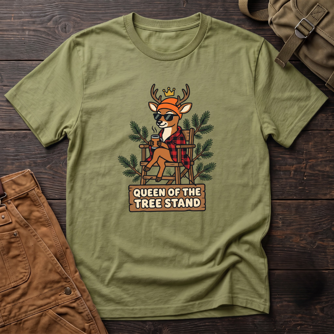 Heather Green funny women's hunting t-shirt with a crowned deer in sunglasses and red flannel sitting in a tree stand above a Queen Of The Tree Stand sign