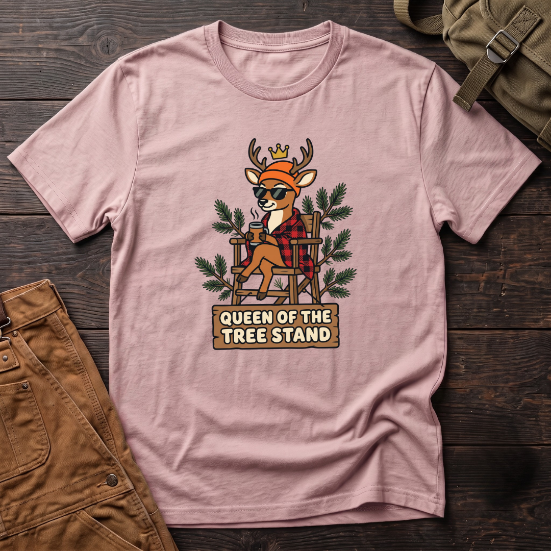 Pink funny women's hunting t-shirt with a crowned deer in sunglasses and red flannel sitting in a tree stand above a Queen Of The Tree Stand sign