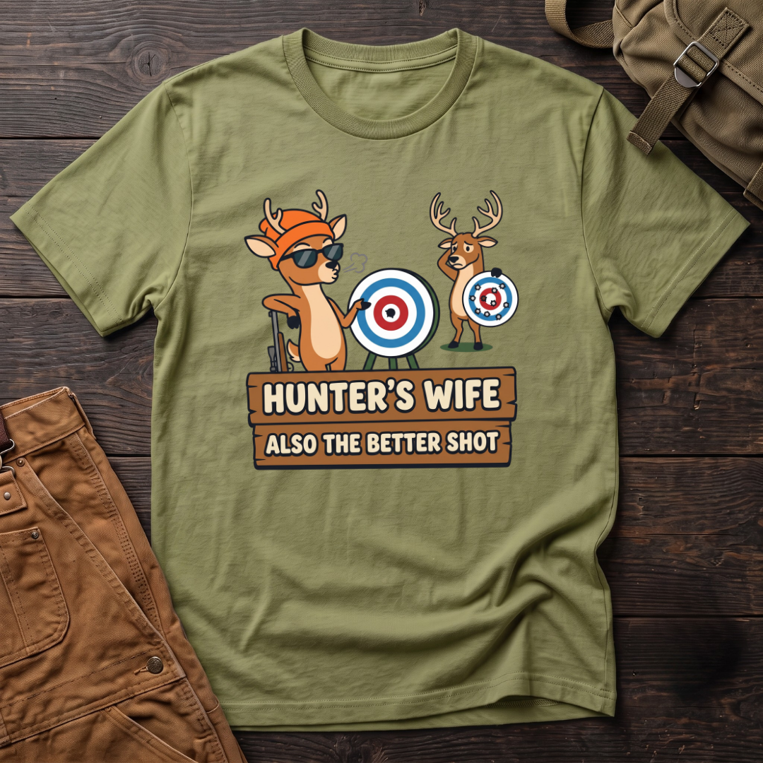Heather Green funny hunter's wife t-shirt with Hunter's Wife Also The Better Shot sign and two cartoon deer with archery targets, one hit dead center