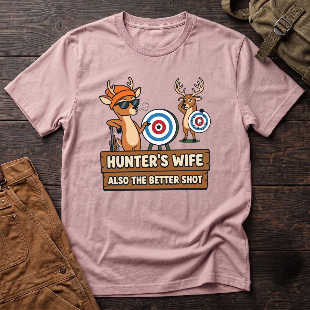 Pink funny hunter's wife t-shirt with Hunter's Wife Also The Better Shot sign and two cartoon deer with archery targets, one hit dead center