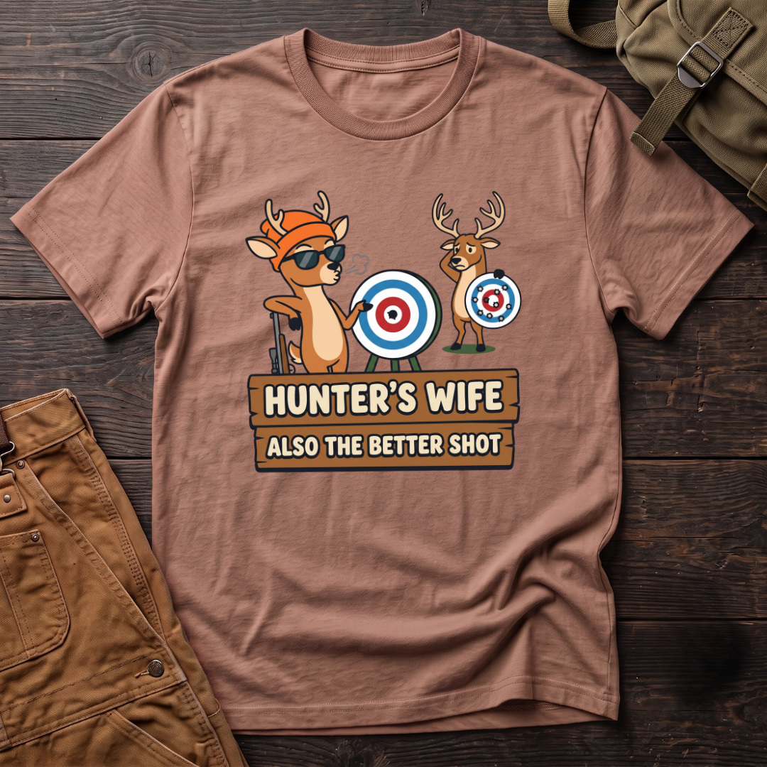 Heather Clay funny hunter's wife t-shirt with Hunter's Wife Also The Better Shot sign and two cartoon deer with archery targets, one hit dead center