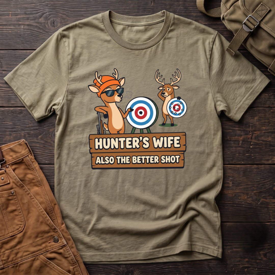 Heather Olive funny hunter's wife t-shirt with Hunter's Wife Also The Better Shot sign and two cartoon deer with archery targets, one hit dead center
