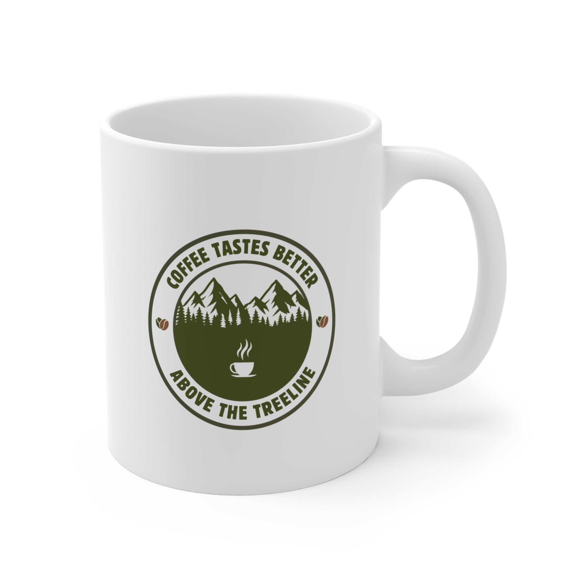 White 11oz ceramic mug on a white background showing the right side with the olive green Coffee Tastes Better Above the Treeline badge graphic, demonstrating the double-sided print.